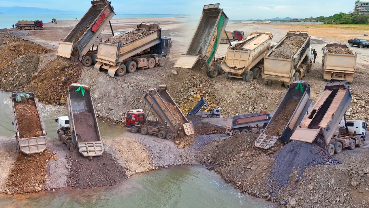 Rock Ppouring Into The Sea Is aAlmost Done,Dumptruck TRAGO 25,5TON Transport Stone And Dozer KOMATSU
