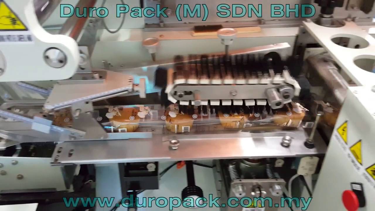 Muffin cake wrapping machine with nitrogen flushing