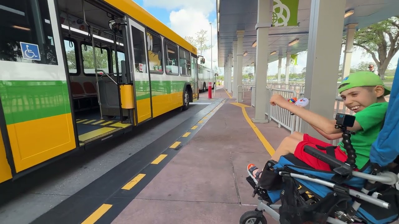 Kayden excited off Disney’s Pluto Bus ramp at EPCOT #bus #busstop #busstand #transport