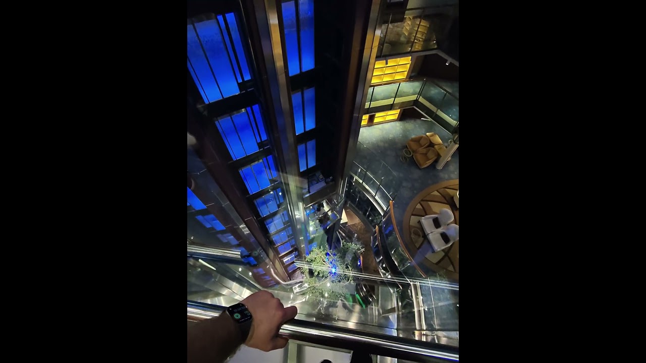 celebrity reflection grand foyer glass elevators 
