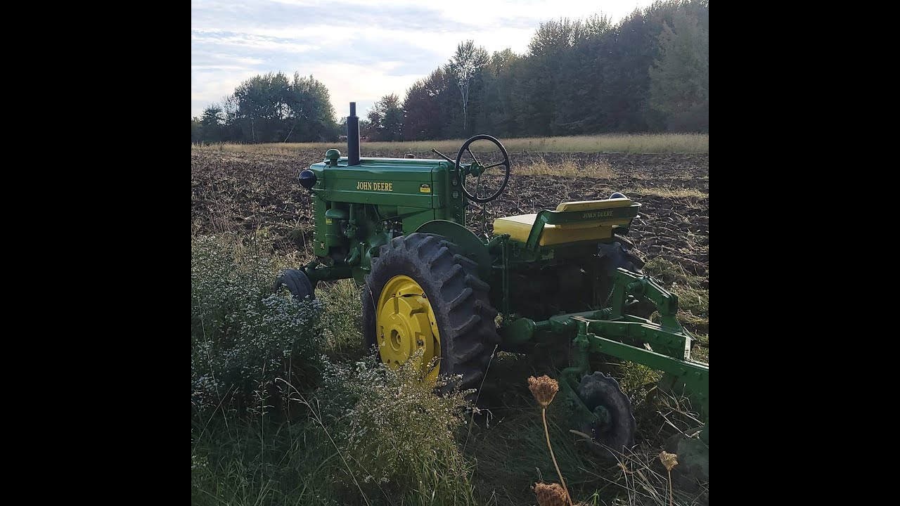 1948 John Deere M Plowing with a m2a plow
