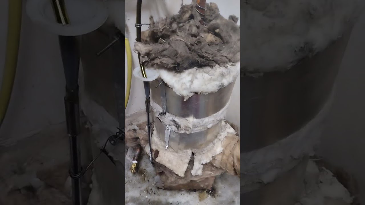 An extremely efficient compact waste oil heater with a water jacket