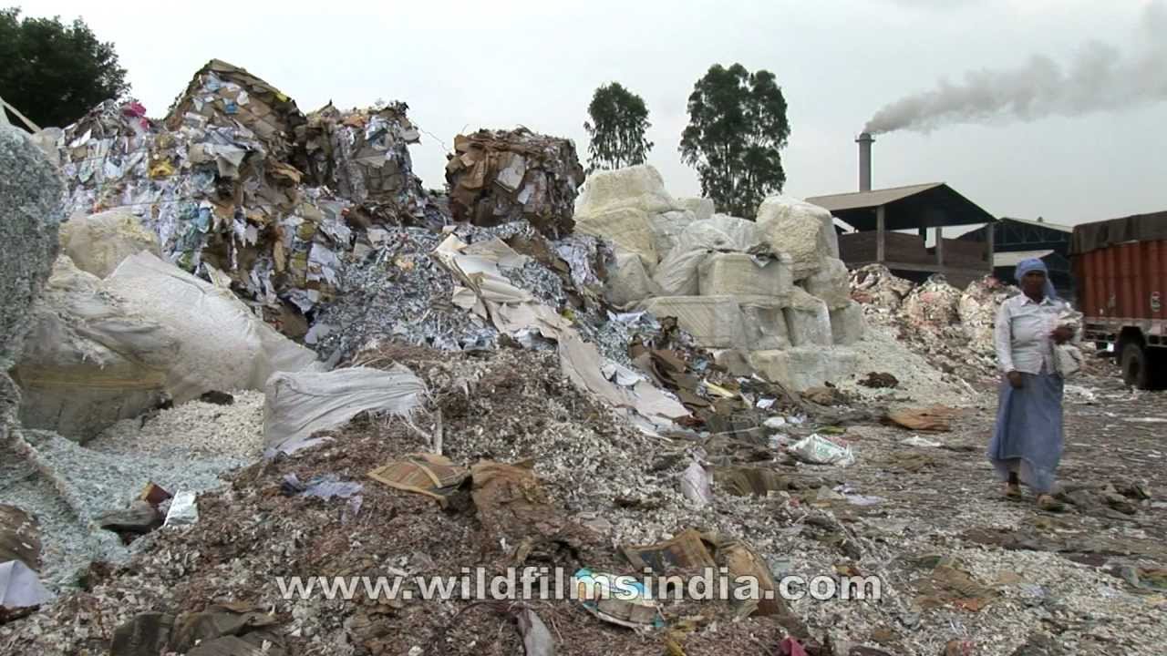 Imported household waste at recycling yard...