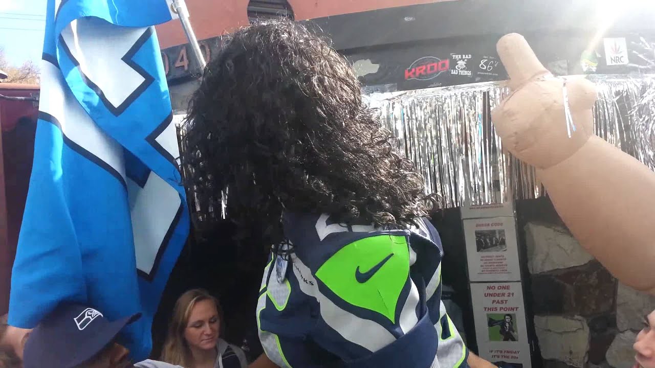 Mama Sherman (Richard Sherman's Mom) Raises The 12th Man Flag At Backstage