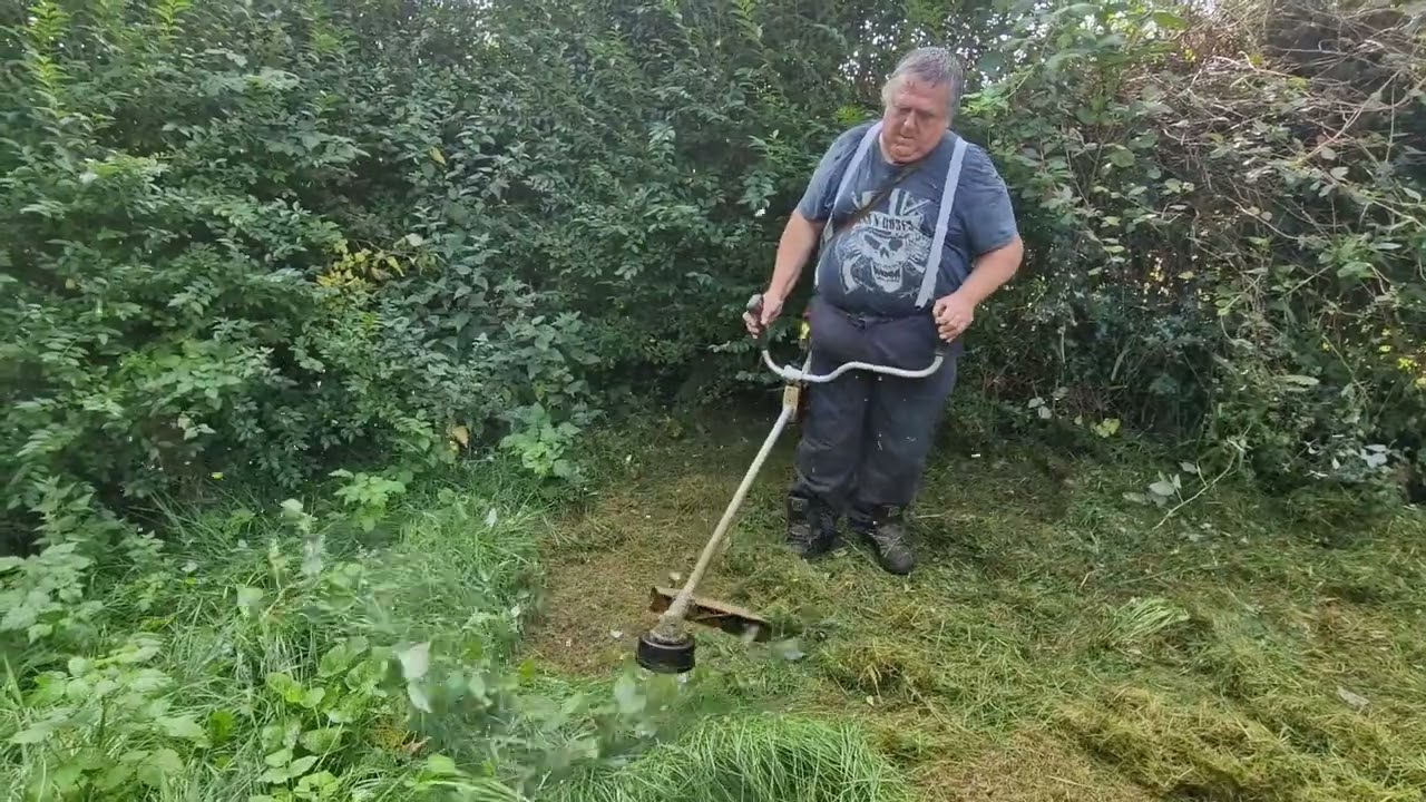 Strimming the back garden.