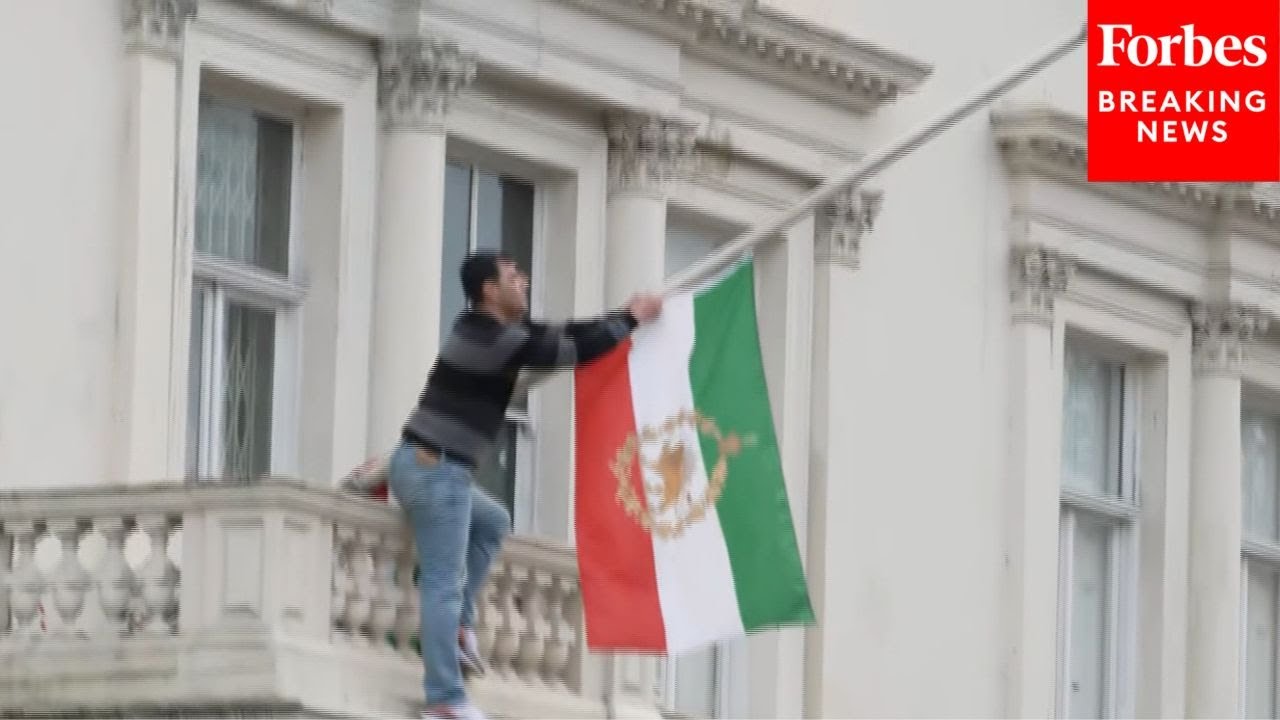 Protester Tears Down Flag From London's Iranian Embassy In Support Of Ongoing Protests In Country