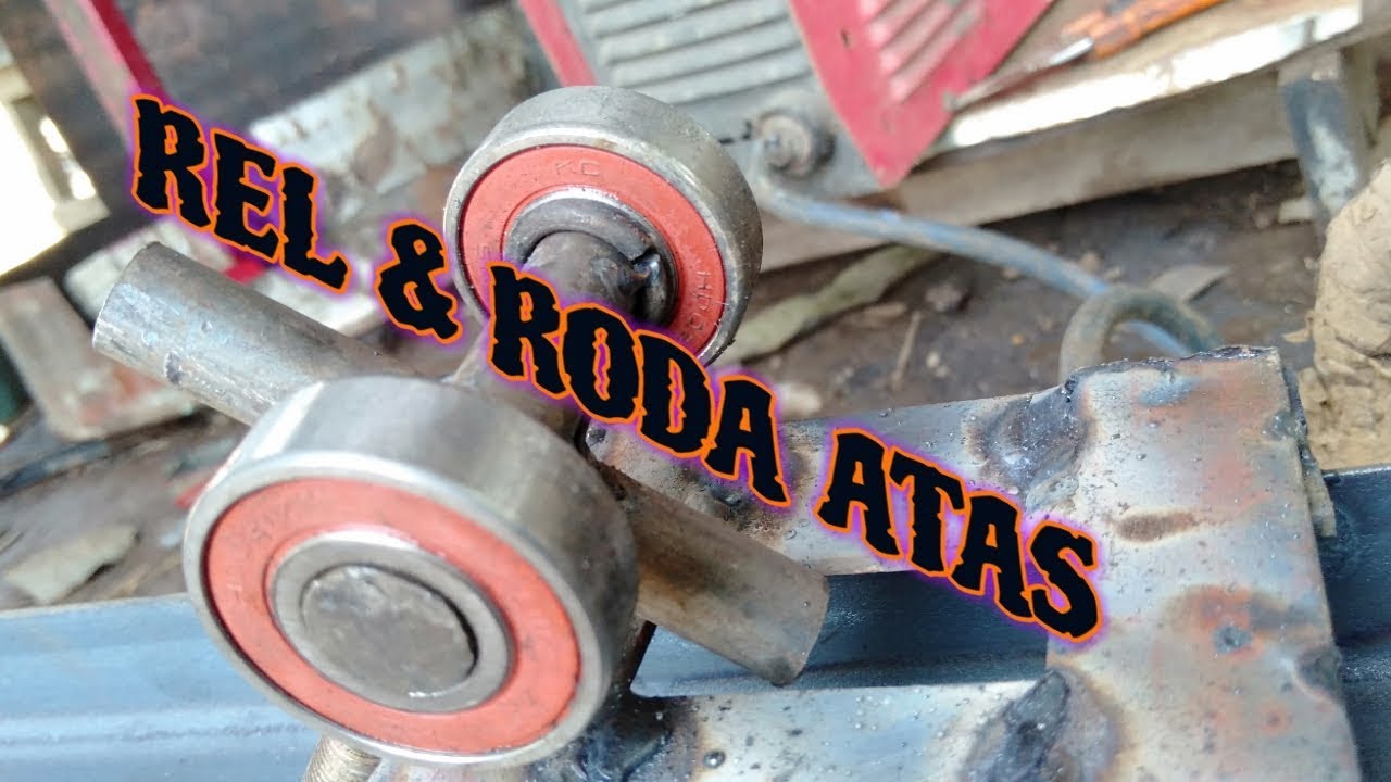 REL DAN RODA ATAS PINTU LIPAT