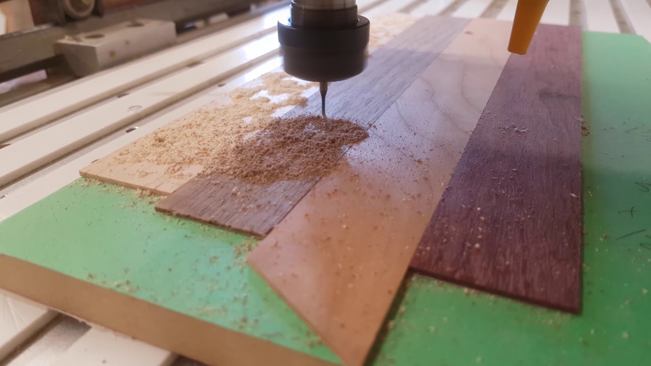 CNC cutting some hardwood puzzle pieces