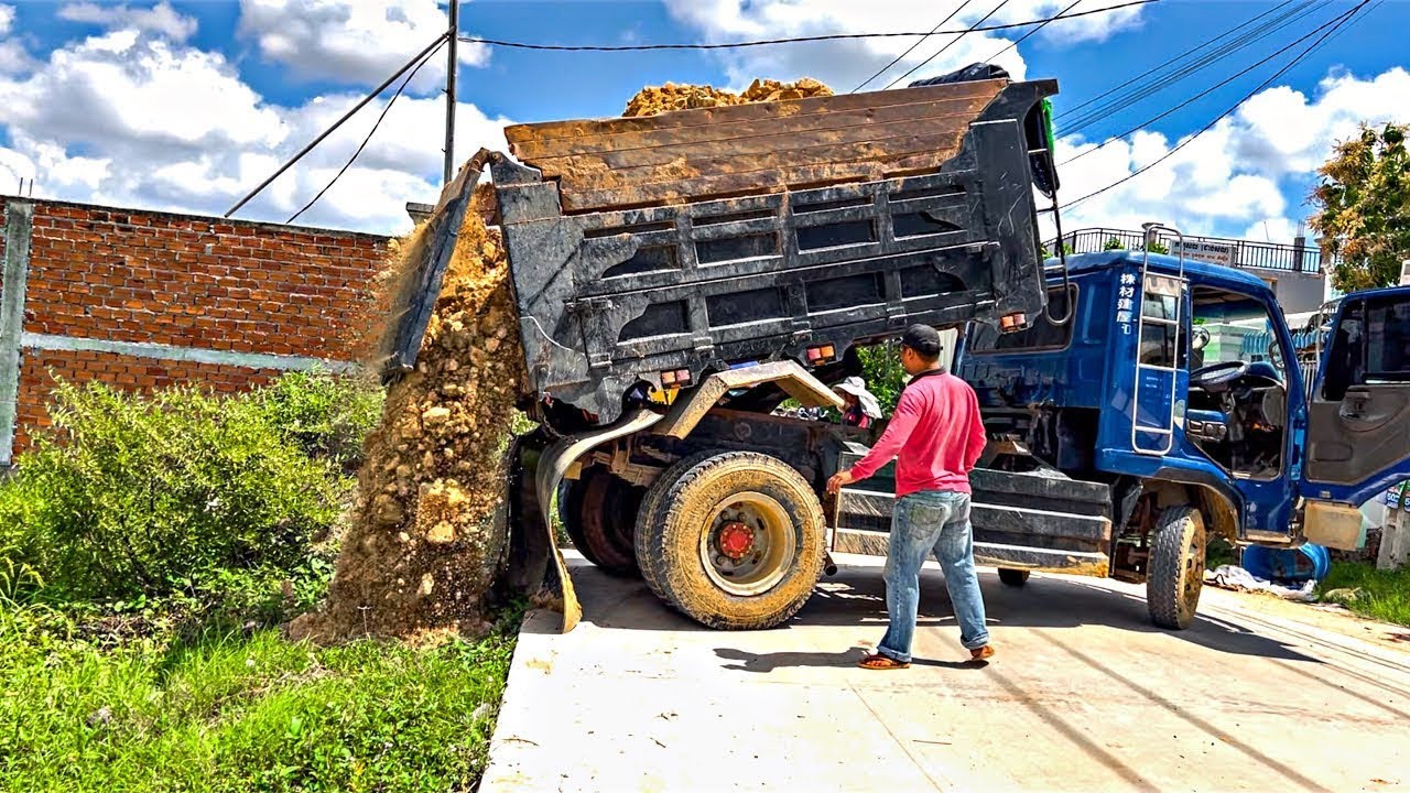 First Start a New Project! Landfill by Dump Truck Unloading Soil with Mini Bulldozer 