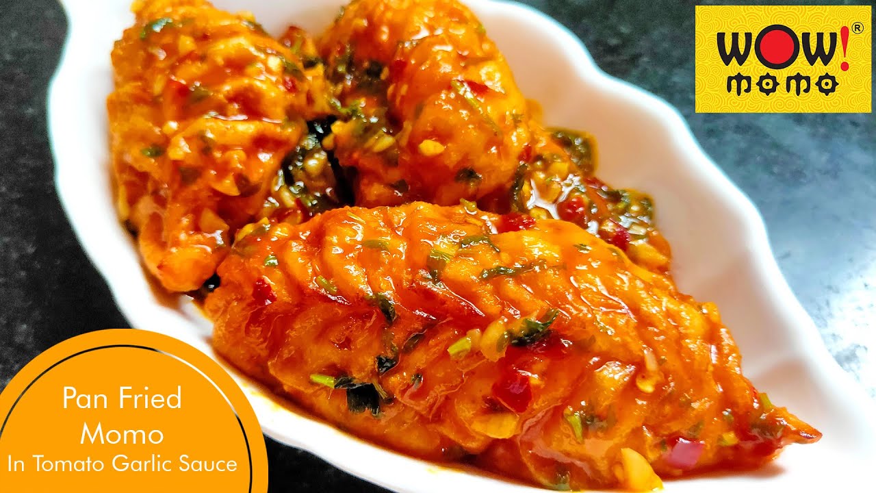 CHICKEN PAN FRIED MOMO IN TOMATO GARLIC SAUCE | WOW MOMO PAN FRIED CHICKEN MOMO RECIPE | TASTE BURST
