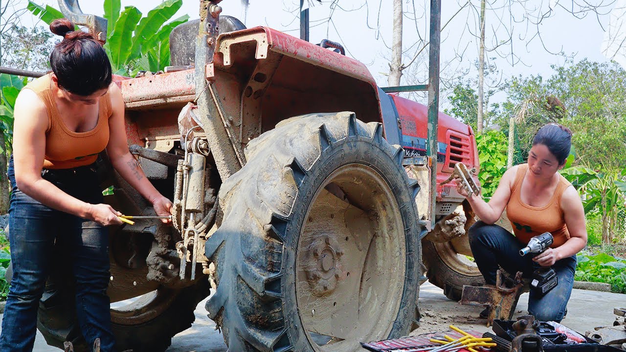 Mechanic girl repairs restores agriculture tractor, mechanical genius girl, blacksmith girl