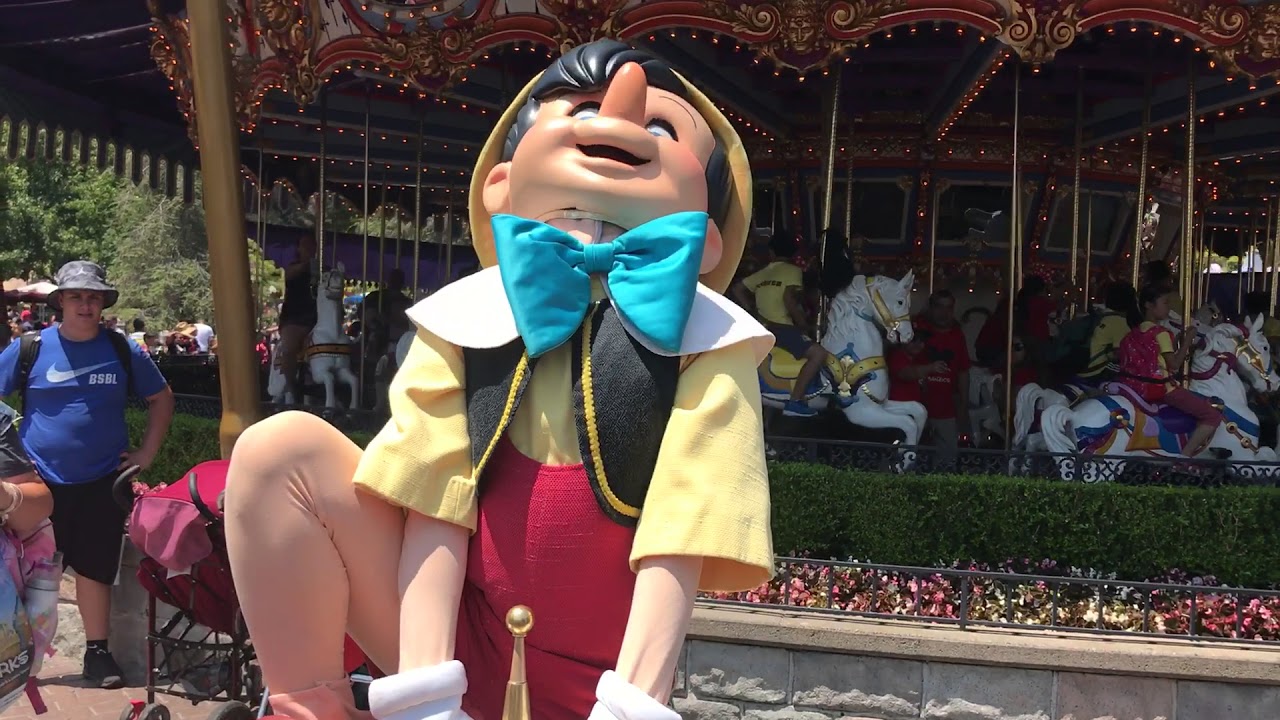 Pinocchio and friends try to pull the Sword in the Stone // Disneyland