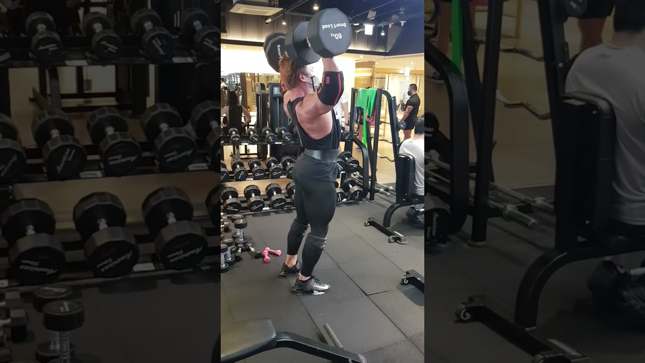60kg dumbbell standing shoulder press