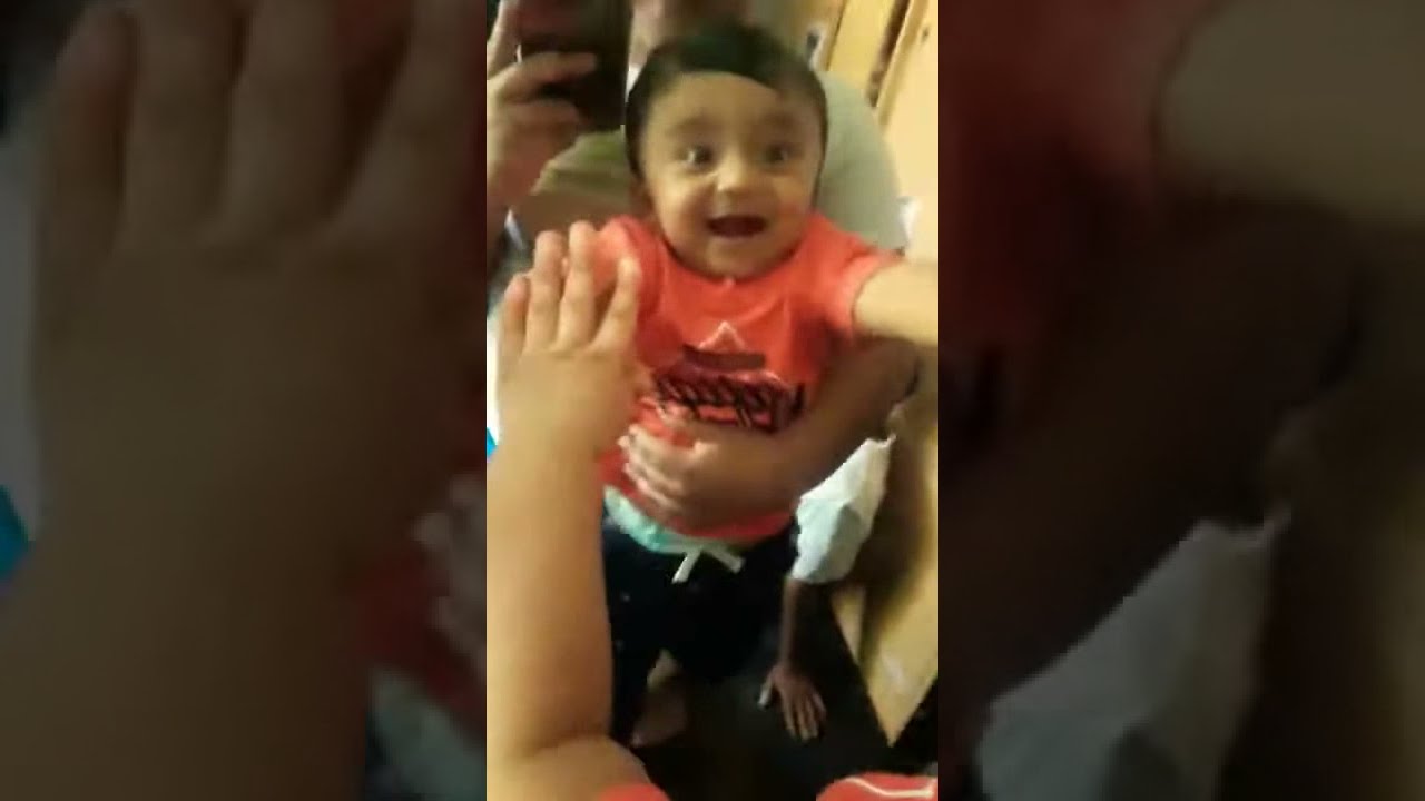 Baby Arian sees a mirror for the first time