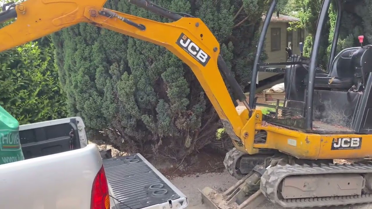 Getting dumpy bag off truck when digger not man enough to lift it