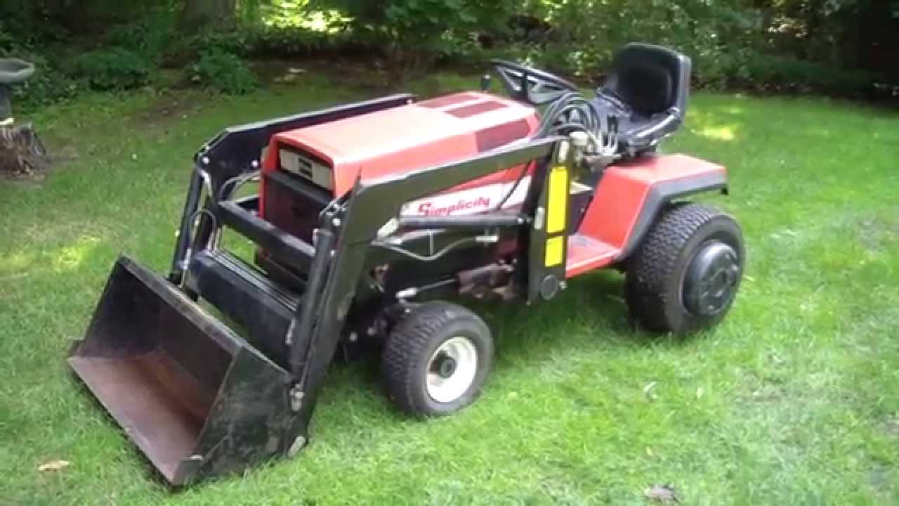 Simplicity Sunstar 20 with a loader, tiller, mower, snowblower
