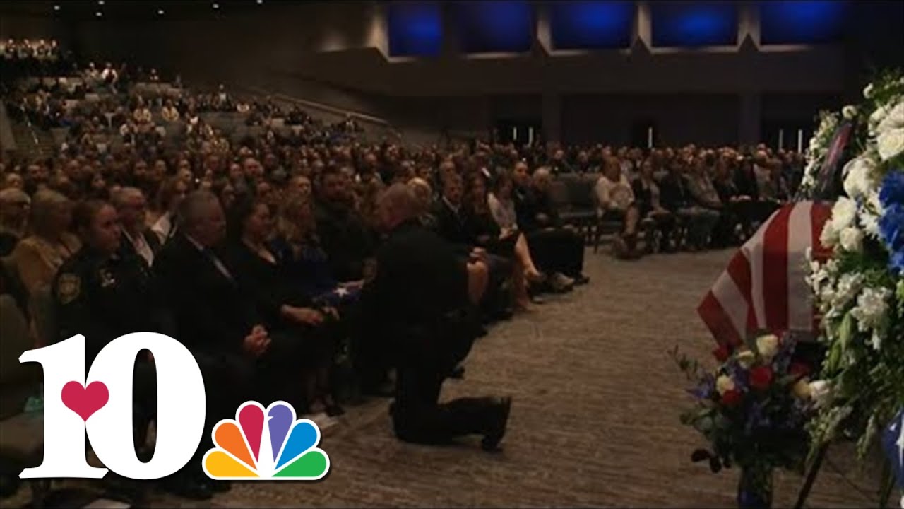 Blount County deputies present folded American flags to those who loved Deputy Greg McCowan