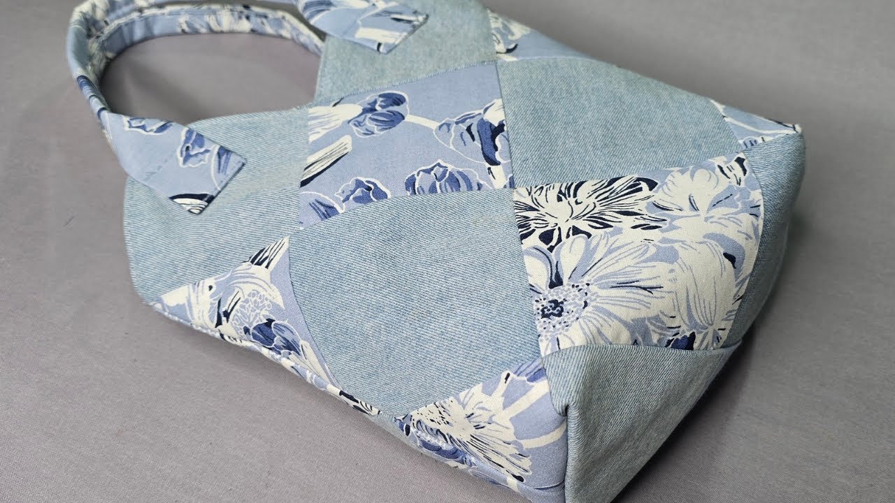 Sewing an eco bag from the recycling of fabric and jeans waste