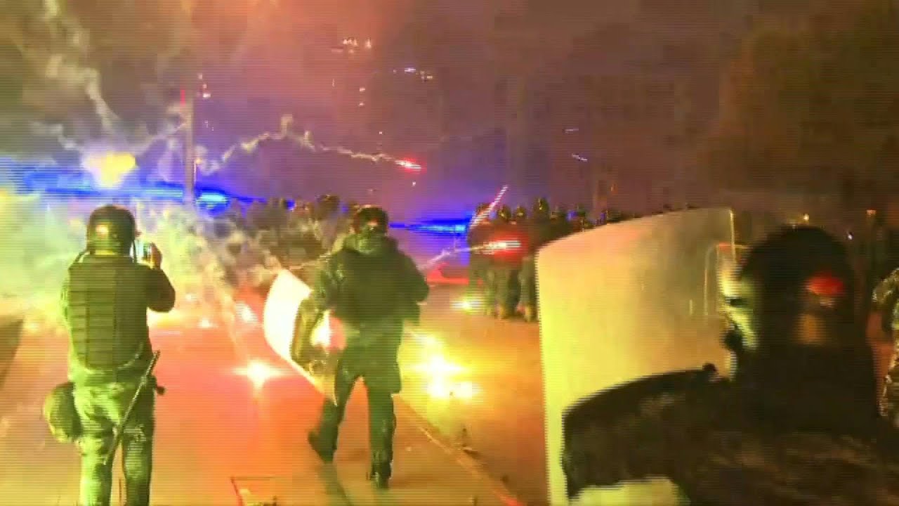 Lebanon's protesters use fireworks during clashes outside parliament