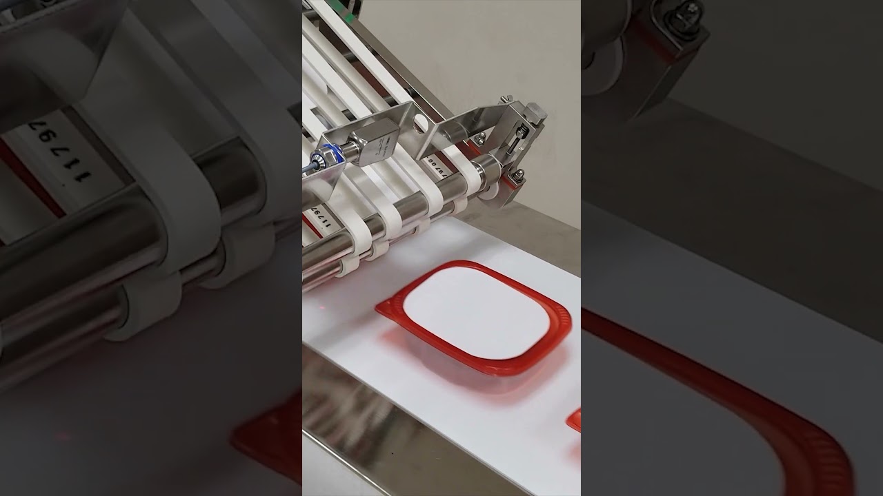Hygienic Friction Feeder Tipping Cards onto Meat Containers  #foodpackaging #packagingautomation