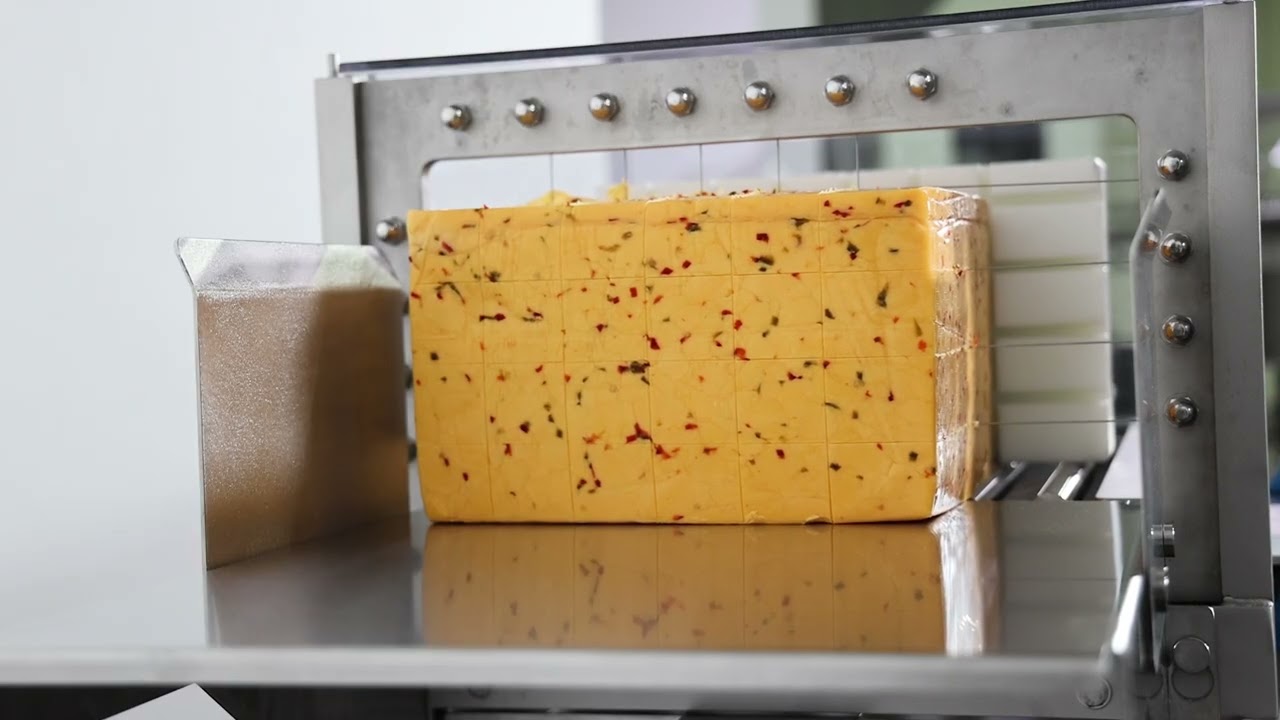 1820 Horizontal Cutter Cutting Through a 40 lb Jalapeno Cheddar Cheese Block