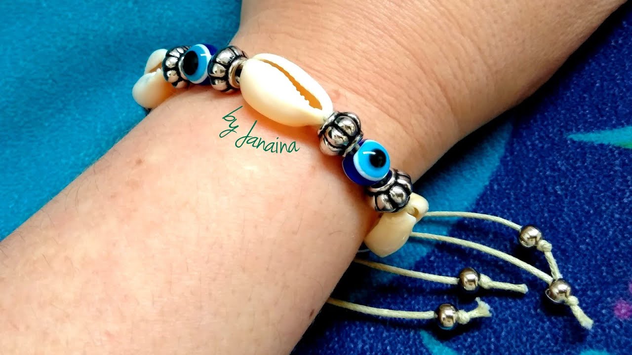 Pulseira de búzios com olho grego@Renata Palmeira Oficial