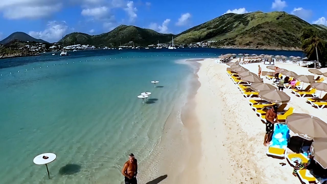 Pinel island, Sint Maarten Beach Therapy // Magical Beach scenery in Caribbean (4k Tropical Drone)
