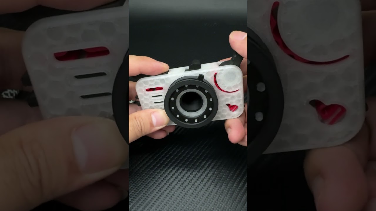 A 3D-printed ten-in-one fidgety toy in the shape of a camera#edc #fidgettoys #fidgetslider