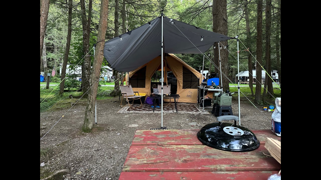 Family Car Camping by Lakeside in an inflatable tent