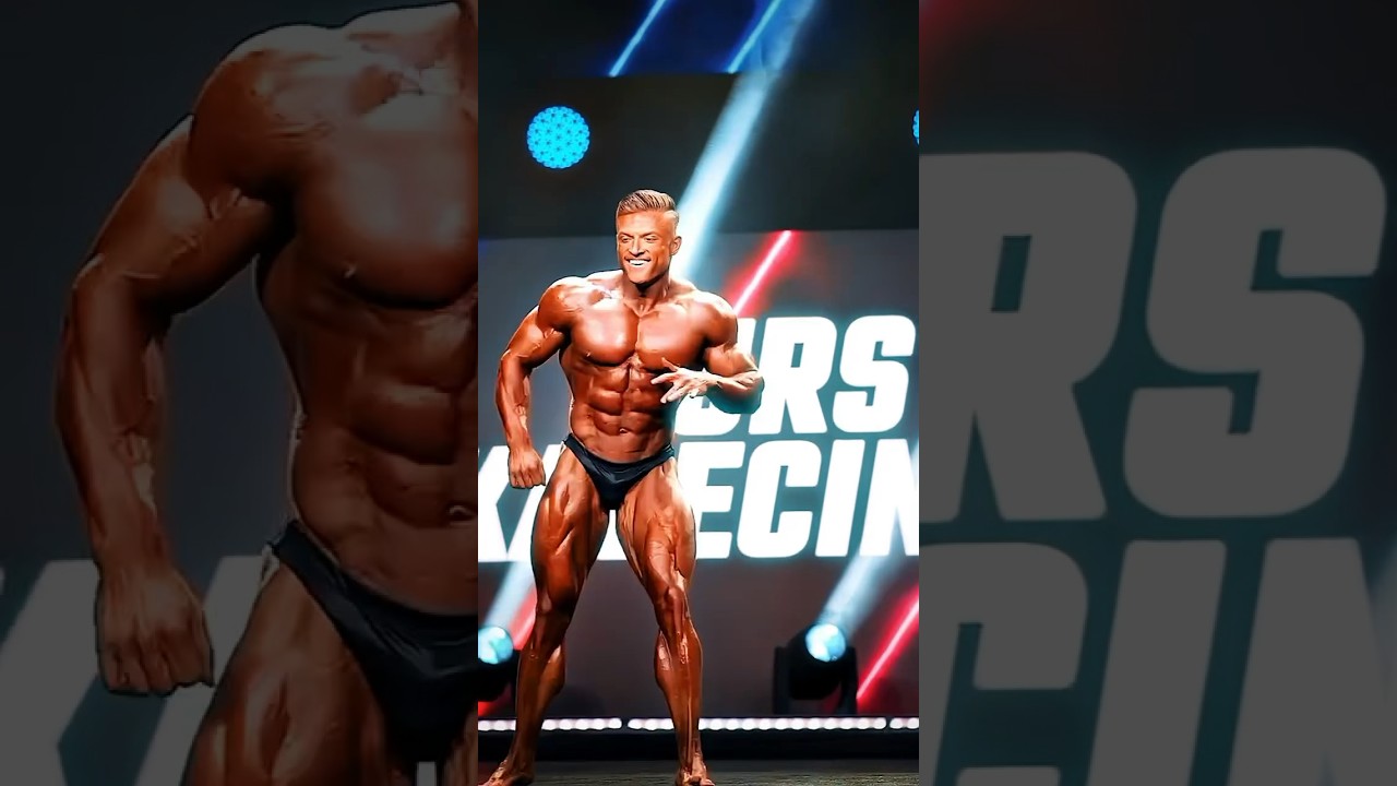 Urs dancing on stage while posing #shorts #bodybuildingmotivation #viral