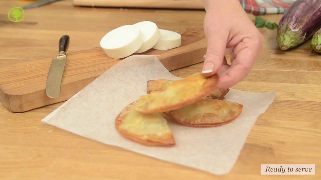 Fried pies stuffed with aubergines, frumenty, manouri cheese