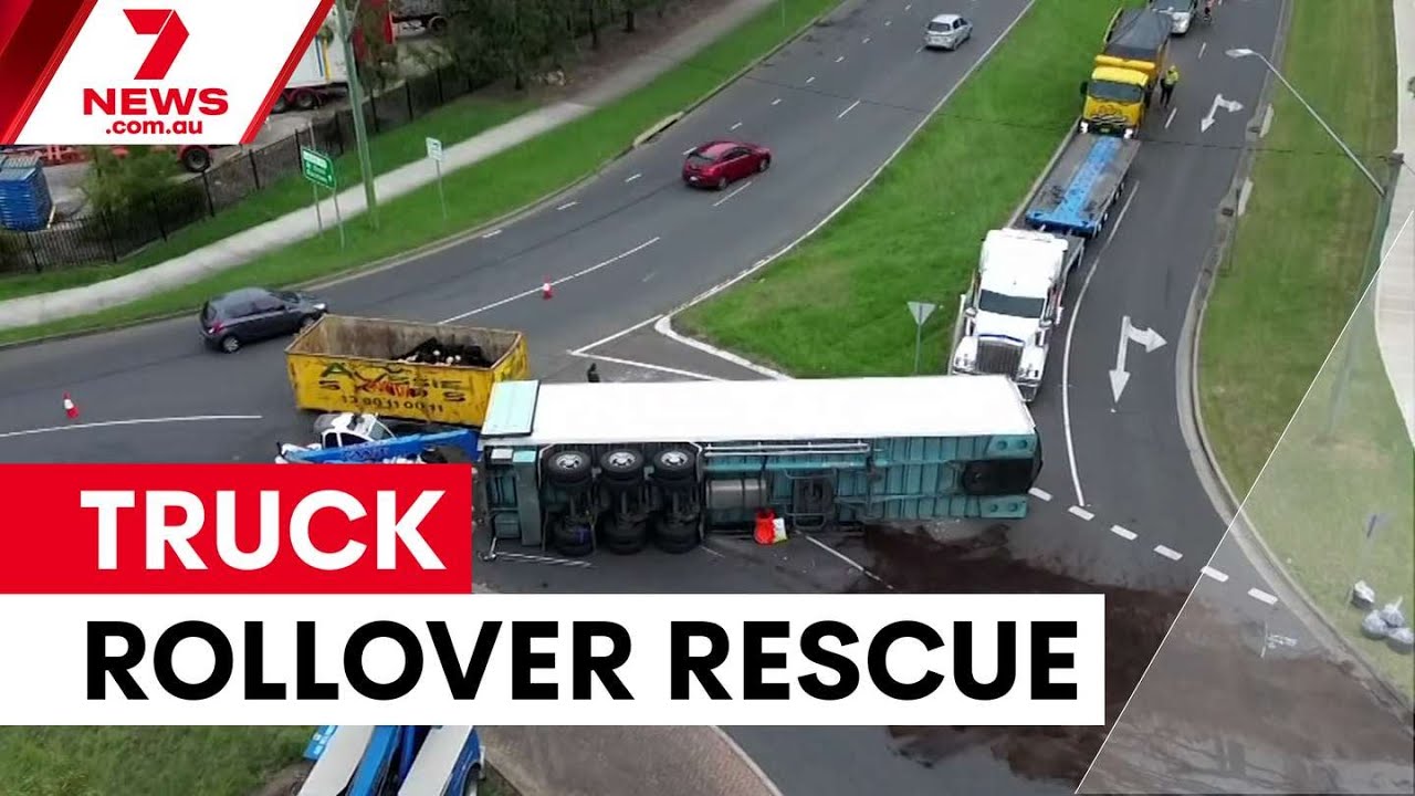 Truck driver freed after overnight rollover in Minchinbury | 7NEWS