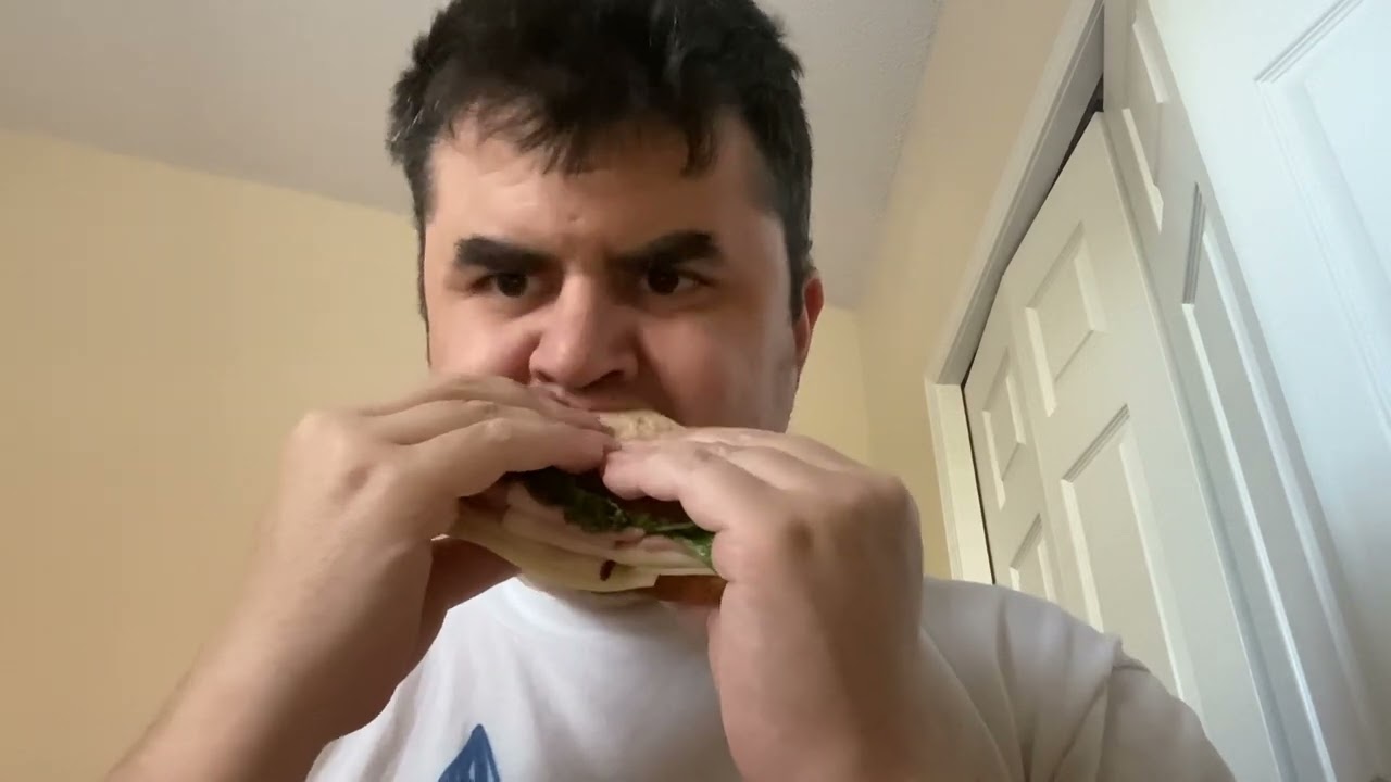 Watch me eating a ham and turkey sandwich on whole wheat bread