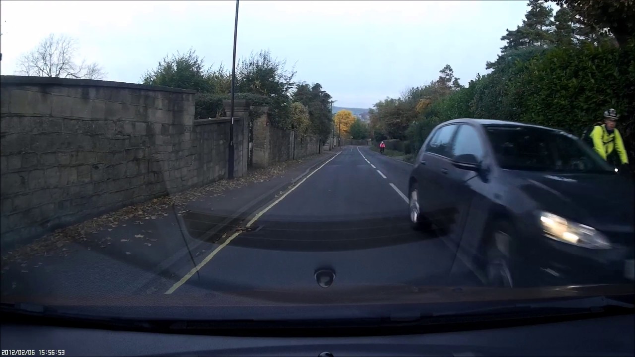 2 cars overtake bike before blind bend