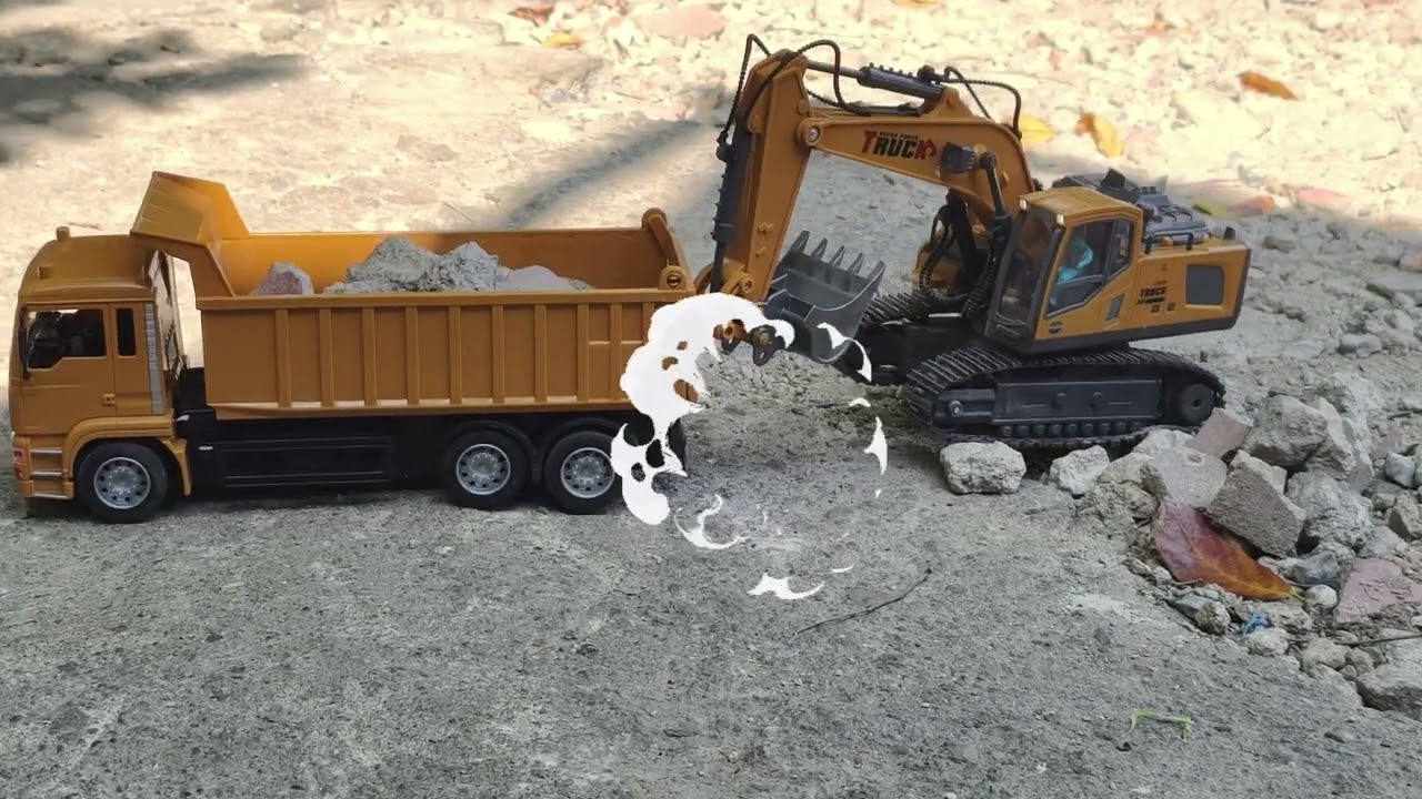 A large excavator is working alongside a dump truck hauling rocks