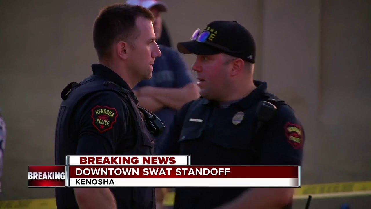 Dozens watch police stand off in Kenosha
