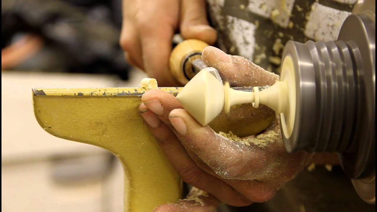 Spinning top w/ captive ring. Skew chisel only.