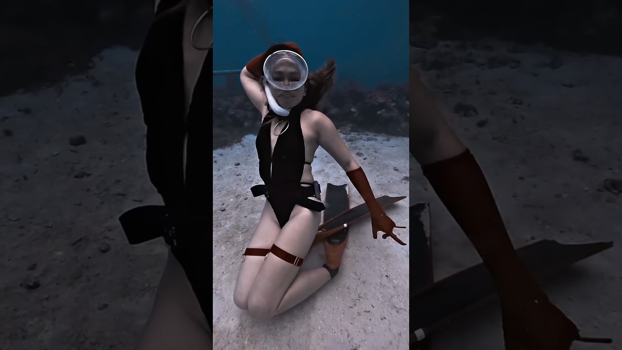 Black bikini freediver striking powerful underwater poses #ocean #freediving #mermaid