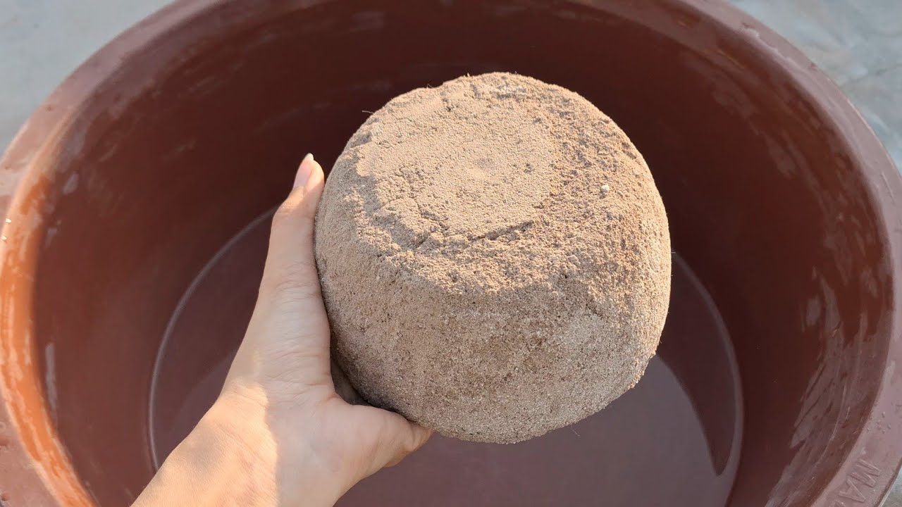 New video Brown sand water crumbling satisfying