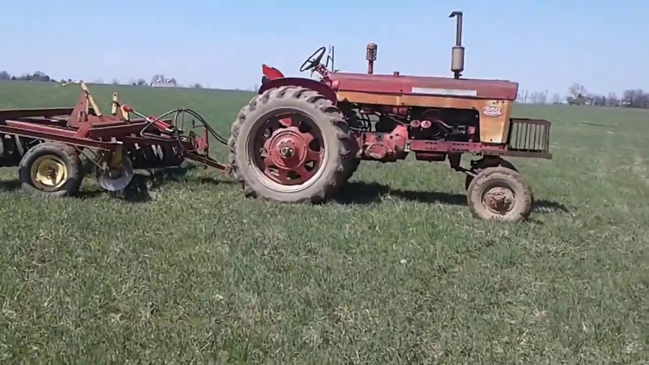 Discing ground with a Farmall 560