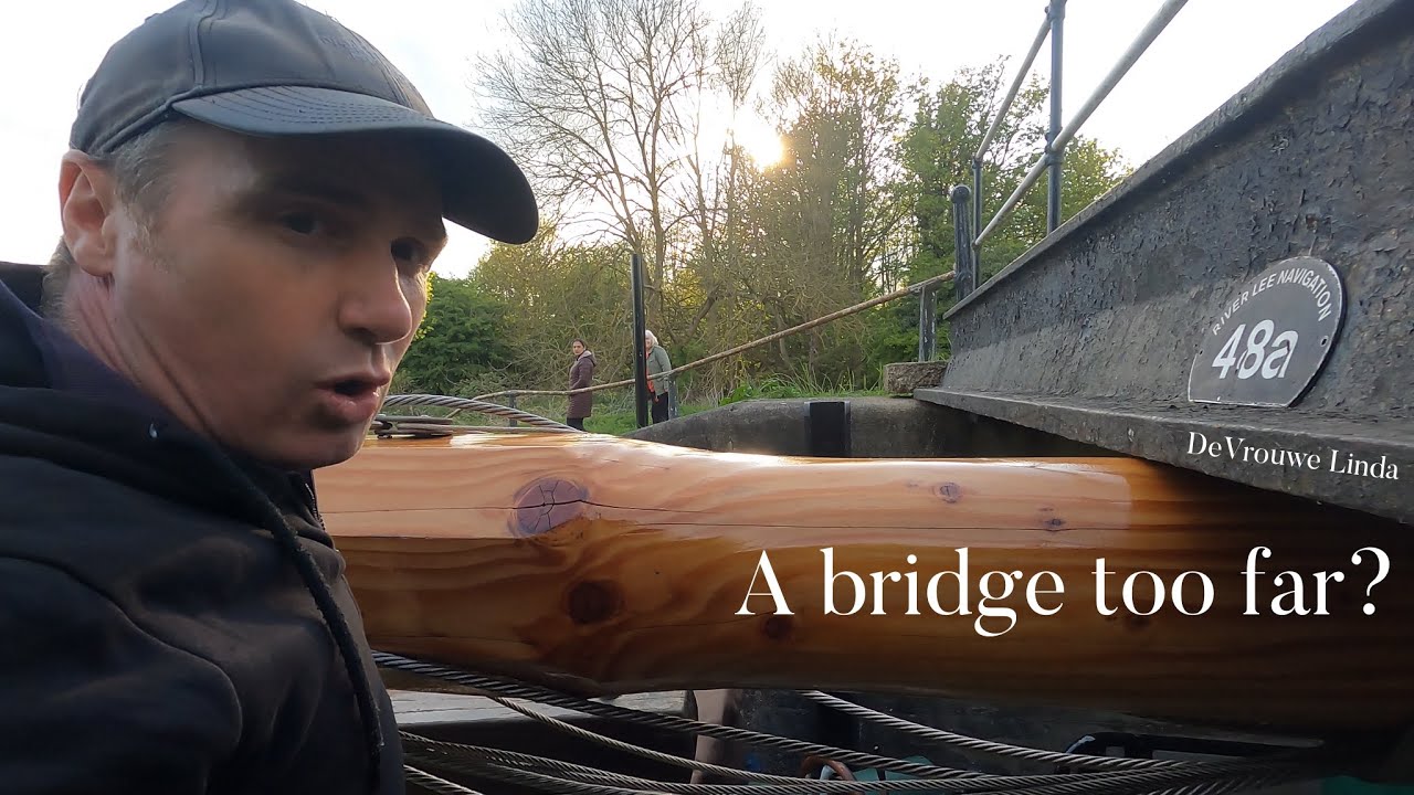 Big sailing boat squeezing through tiny canal bridges. Dutch Barge Linda 90