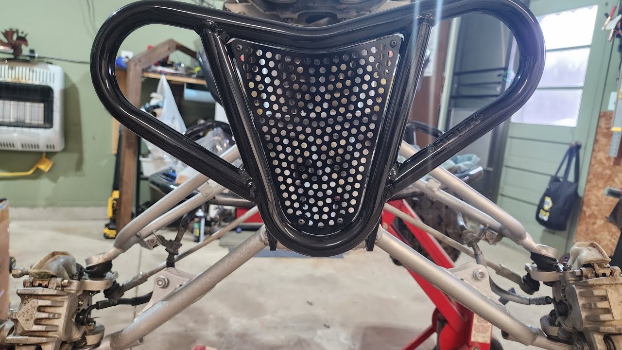 I added the new upper A-arm to the trx450r! 