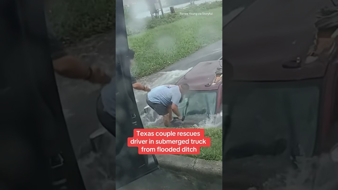 Texas couple rescues driver in submerged truck from flooded ditch #shorts