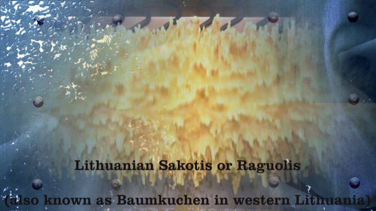 Cooking Traditional Lithuanian sakotis cake on skewer