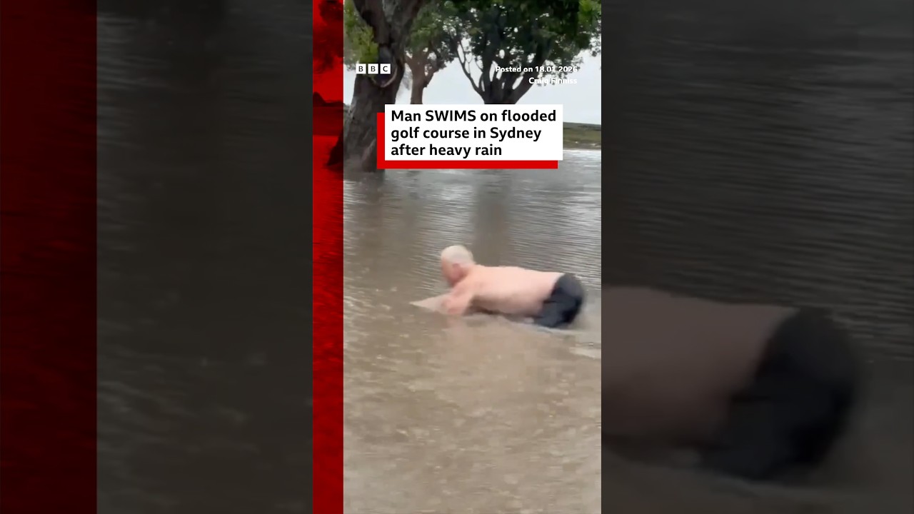 Man swims on flooded golf course in Sydney after heavy rain. #Australia #BBCNews