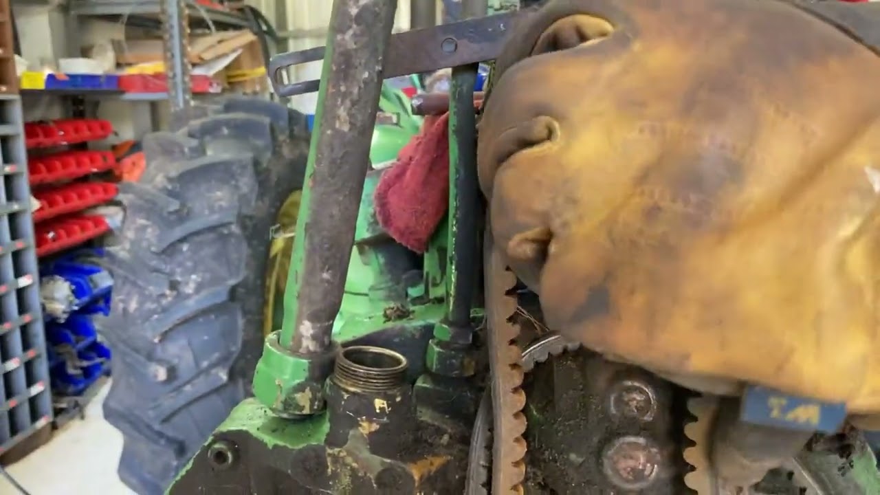 How to remove the ￼fan belt from a John Deere 420