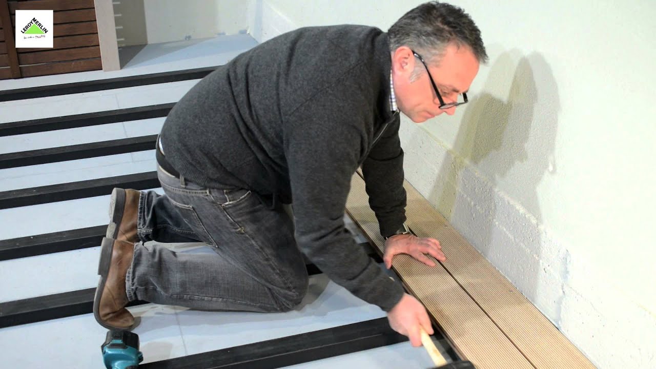 Colocar suelo de lamas de composite