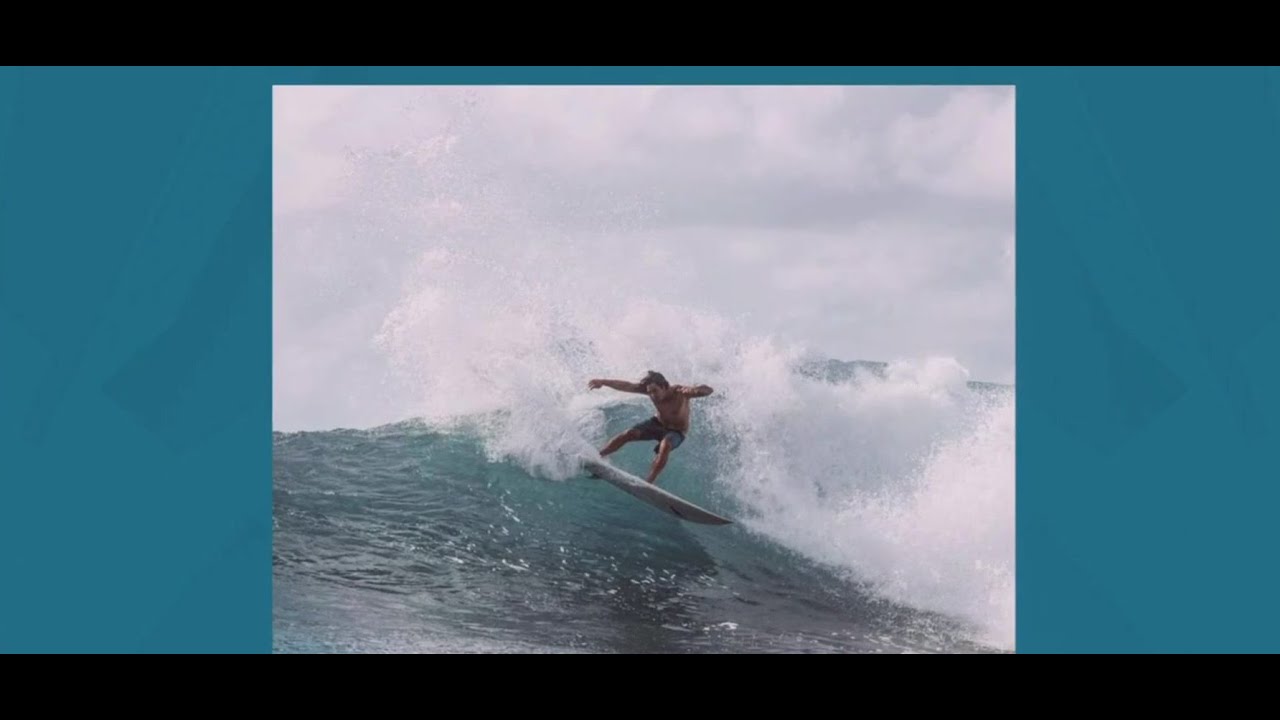 Chris Latronic whips it forward as he catches an epic wave