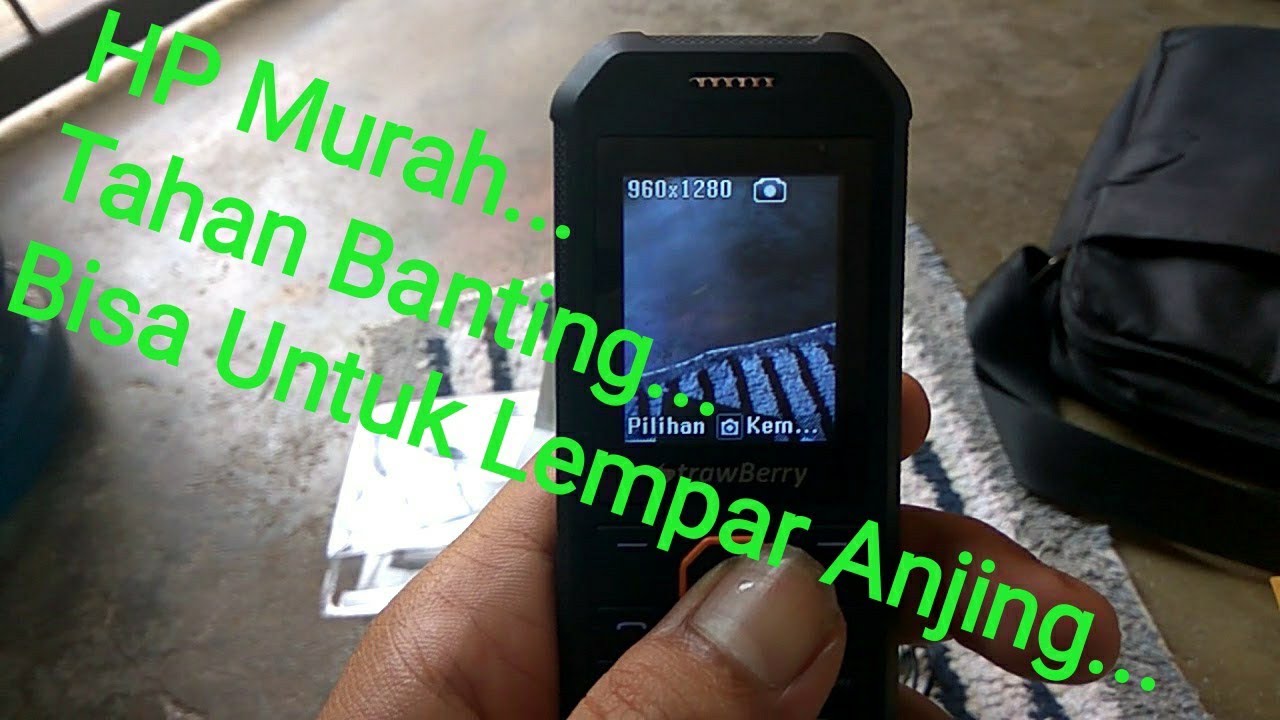 Review HP Strawberry ST338 Fortuna. Harga 170 rb. Tahan benturan, tahan percikan air dan anti debu