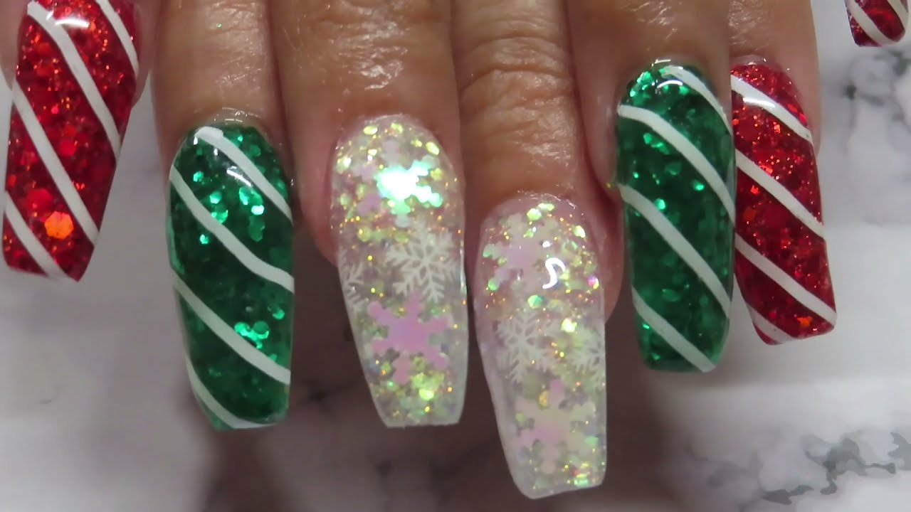 Candy cane nails with snow flakes
